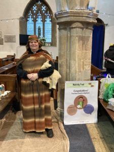 person dressed as a shepherd for a nativity