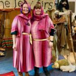 two women dressed in bible times clothing