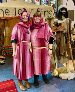 two women dressed in bible times clothing